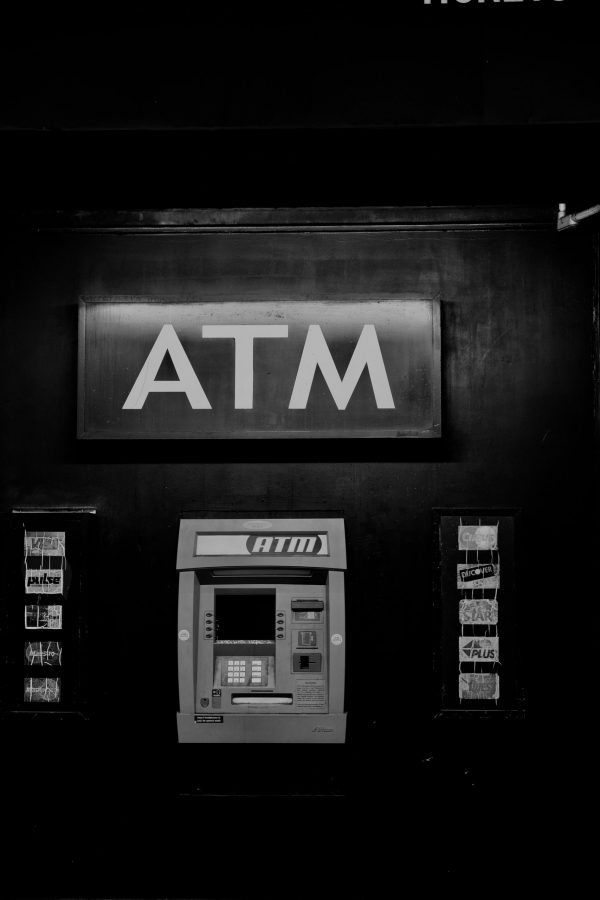 History of money: Early example of an ATM cash machine in black and white