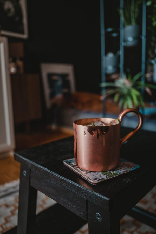 Copper mining and copper extraction: Copper mug placed on a wooden bench