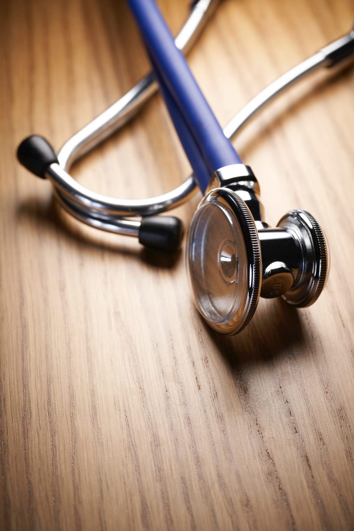 Rare earth elements or rare earth minerals: Stethoscope on a wooden desk