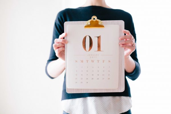 Pension schemes: A woman holding up a calendar with the page stating 1st January