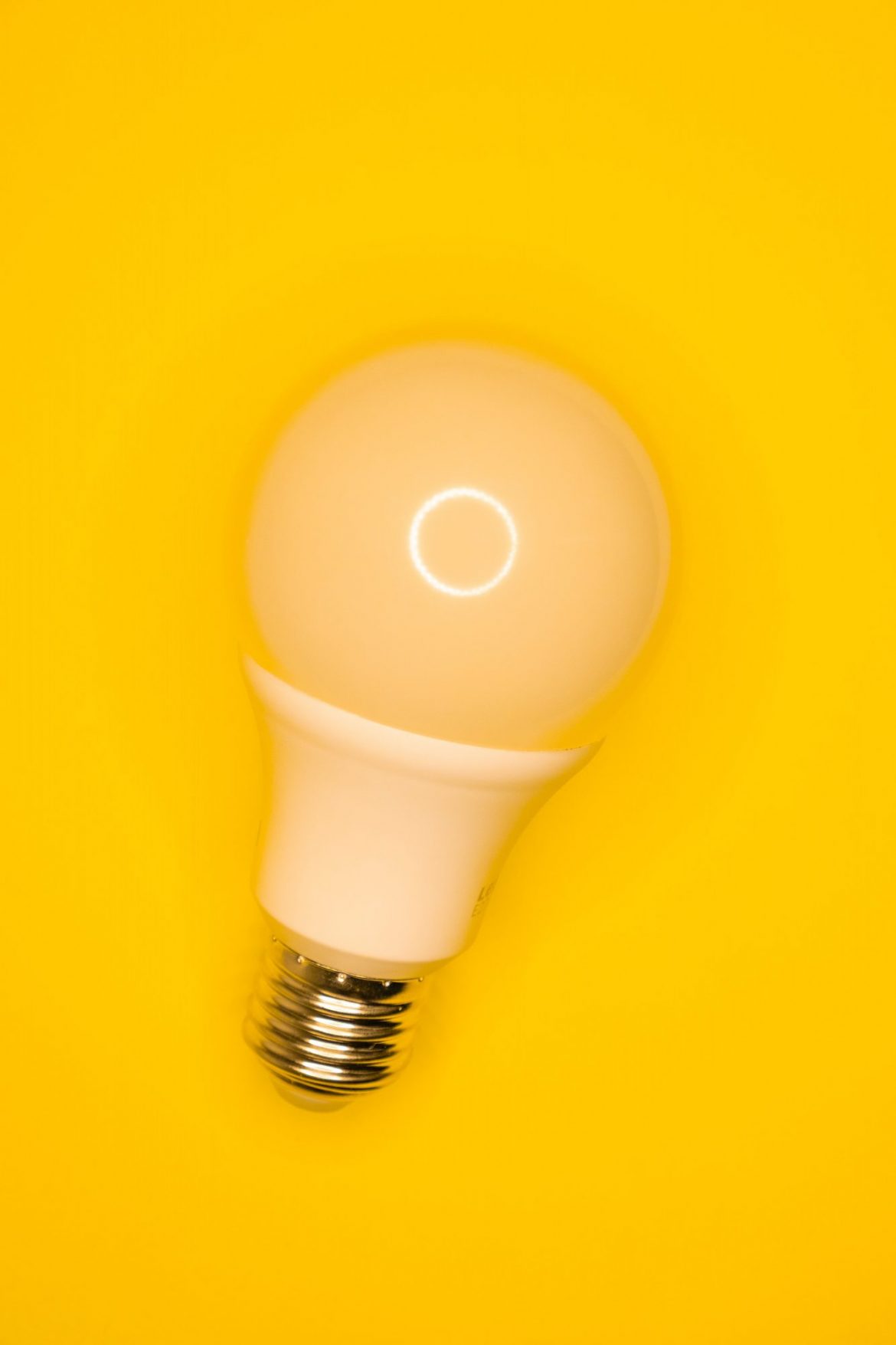 Oracle Power (ORCP) Share Price News: Single light bulb against a yellow background