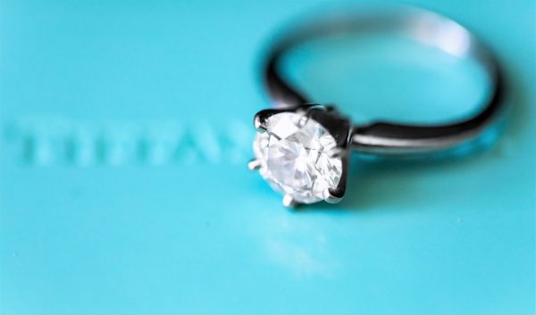 Diamond market: Diamond ring placed against a blue background