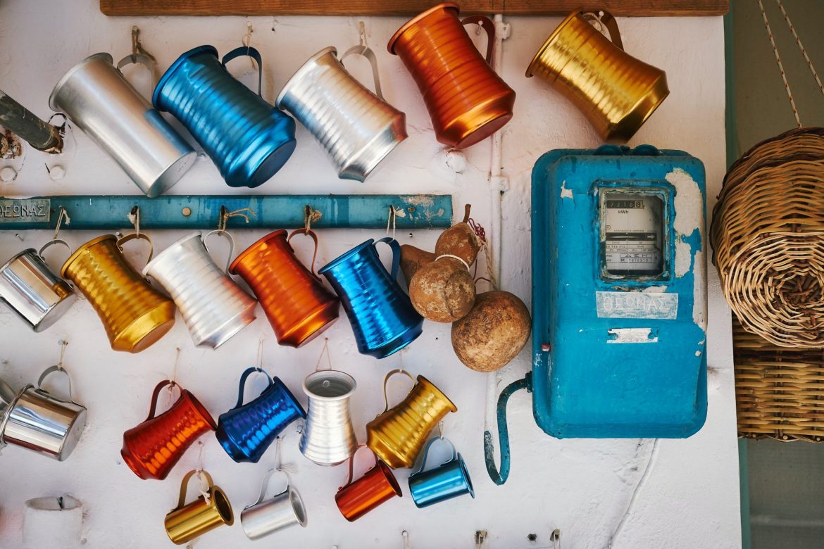 Ariana Resources (AAU) Share price news: A number of different coloured tankards hanging on a wall