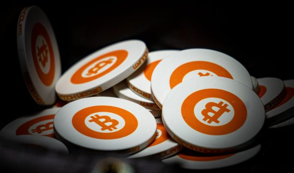 What is cryptocurrency: A selection of casino chips with the Bitcoin logo imprinted on each