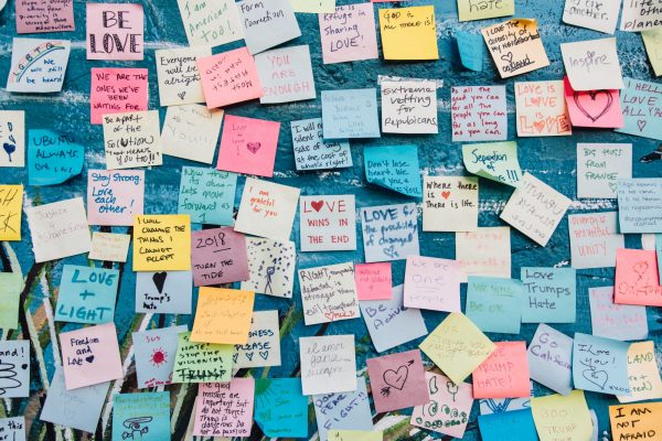 Pension freedom rules: Several post-it notes stuck to a blue wall