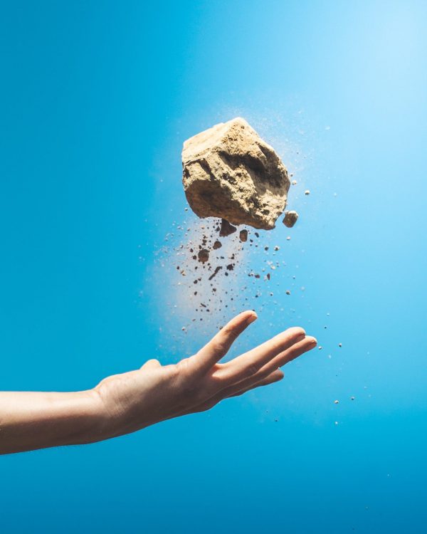 Premier African Minerals Plc PREM Share Price News: Rock being thrown into the air and pieces crumbling