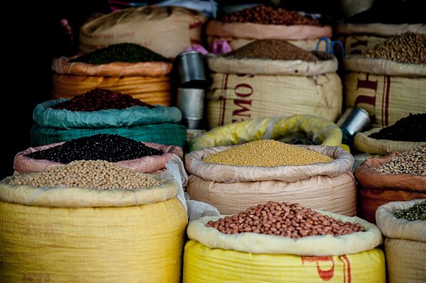 Investing in commodities: Different agricultural commodities held in storage sacks: