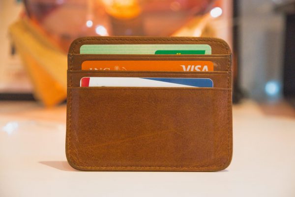 What is open banking: Brown wallet or cardholder with three cards